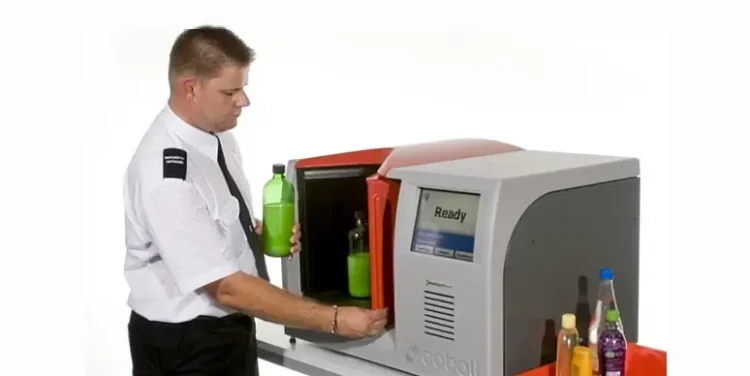 Airport security using the bottle scanner to check for hazardous substances. Photo by the GOTT.