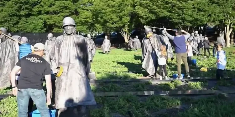 Defense Secretary Pete Hegseth cleans the Korean War Memorial in Washington, May 24, 2025. Photo by the DOD.