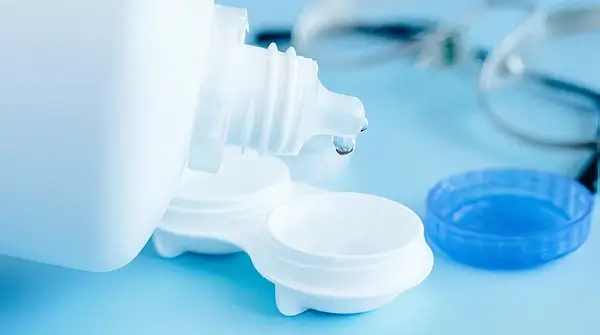 Working with a clear solution in the lab. Photo by the Medicines and Healthcare products Regulatory Agency.