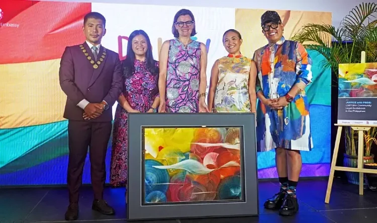 Ambassador Laure Beaufils presented with a reproduction of Justin Nuyda’s Search Mindscape. Photo by the British Embassy in Manila.
