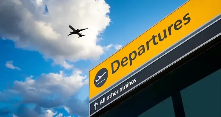 Departures sign with plane overhead. Photo by the Department for Transport.