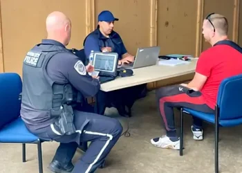 Inspectors interviewing transportation company owners. Photo by the Oregon Department of Transportation Commerce and Compliance Division.