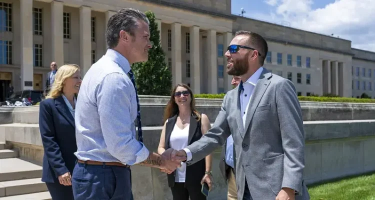 NASCAR Coca-Cola 600 winner Ross Chastain shakes hands with Defense Secretary Pete Hegseth outside the Pentagon's River Entrance. Photo by NPO Kubitza.