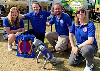 The STEP team pose with a robot dog. Photo by UK Industrial Fusion Solutions Ltd.
