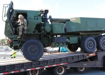 A soldier assigned to the 25th Infantry Division climbs out of a vehicle while loading a High Mobility Artillery Rocket System at Joint Base Pearl Harbor-Hickam, Hawaii, July 14, 2025. Photo by ASS Warren.