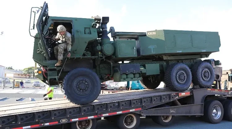 A soldier assigned to the 25th Infantry Division climbs out of a vehicle while loading a High Mobility Artillery Rocket System at Joint Base Pearl Harbor-Hickam, Hawaii, July 14, 2025. Photo by ASS Warren.