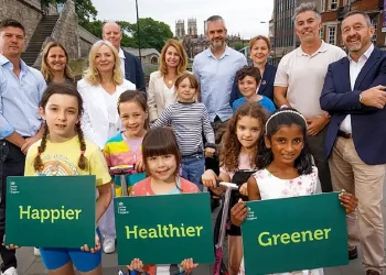 Chris Boardman, mayors and kids promoting new development. Photo by Active Travel England.