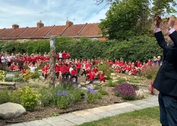 Councilor Leigh Redman celebrates launch of SuDS scheme at Eastover Primary school. Photo by the Environment Agency.