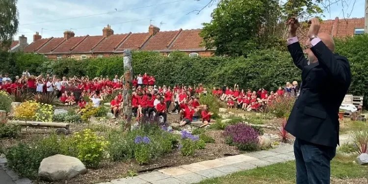 Councilor Leigh Redman celebrates launch of SuDS scheme at Eastover Primary school. Photo by the Environment Agency.