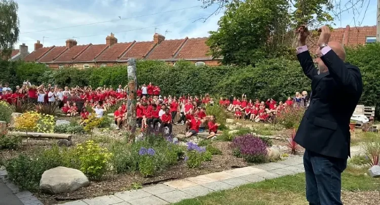 Councilor Leigh Redman celebrates launch of SuDS scheme at Eastover Primary school. Photo by the Environment Agency.