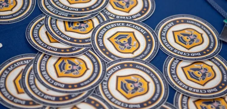 Defense Department Cyber Service Academy stickers at the DOD CSA cyber boot camp held at George Washington University's Science and Engineering Hall, July 21-22, 2025. Photo by DOD Corbin Stewart.
