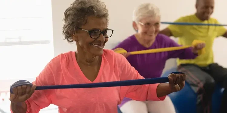 Elderly people doing exercises in a group. Photo by Wavebreak Media - Shutterstock.