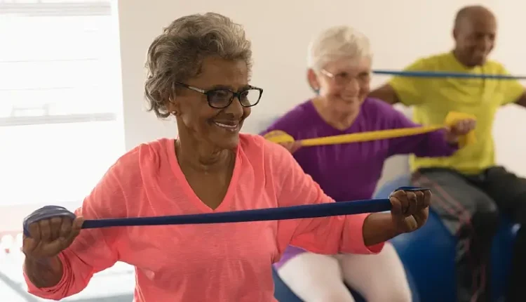 Elderly people doing exercises in a group. Photo by Wavebreak Media - Shutterstock.