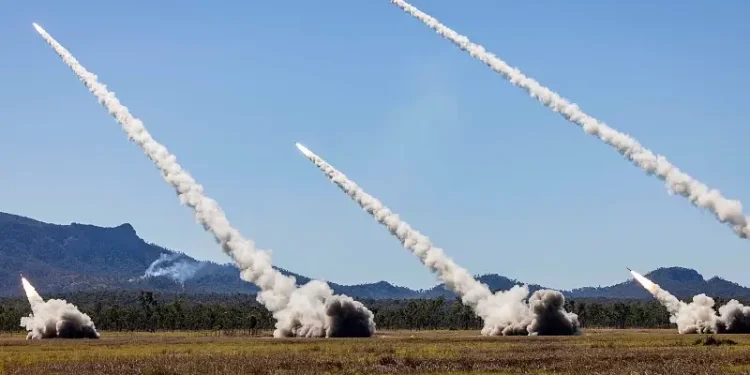 High Mobility Artillery Rocket Systems from the Australian army, the U.S. Army and the Singapore army fire rockets during live-fire exercise in Queensland, Australia, July 14. Photo by the ADF.