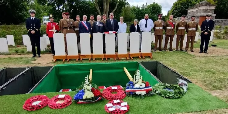 Members of the Grayston and Morrant families stand at the graveside with the military party. Photo by the MoD.