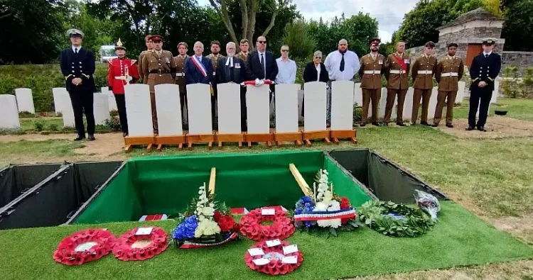 Members of the Grayston and Morrant families stand at the graveside with the military party. Photo by the MoD.
