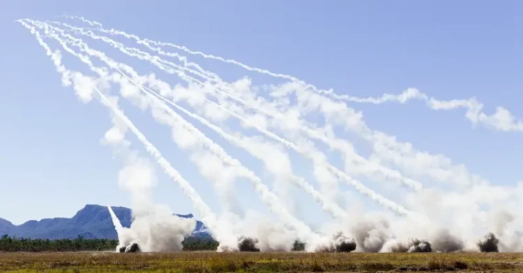 Rockets streak into the air from six M142 High Mobility Artillery Rocket Systems during a combined live-fire portion of Exercise Talisman Sabre 25 in Australia, July 14, 2025. Photo by Keeler.