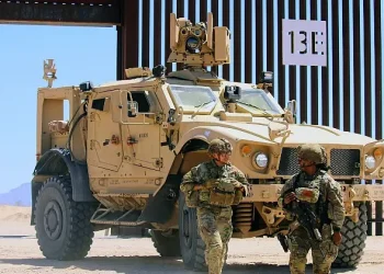 Soldiers assigned to Joint Task Force Southern Border leave their vehicle to patrol along a protective barrier in Yuma, Ariz., June 27, 2025. Photo by 2nd Lt. Esterly.