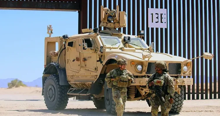 Soldiers assigned to Joint Task Force Southern Border leave their vehicle to patrol along a protective barrier in Yuma, Ariz., June 27, 2025. Photo by 2nd Lt. Esterly.