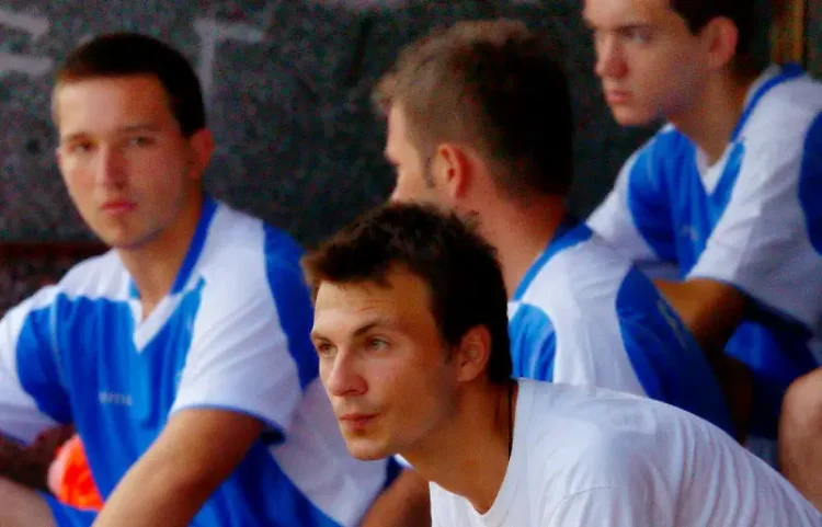Young Bosnia players on the bench. Photo by Marc Neal.
