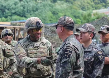 Army Col. Dwight Towler, 2nd Infantry Division, and South Korean Brig. Gen. Woon Jang Lee greet each other during a water purification training exercise. Photo by the DoD.