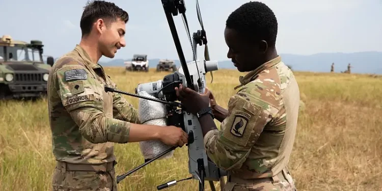 Army Spc. Tyler Dooros, left, and Staff Sgt. Nathaniel Daniels, platoon sergeant, prepare a PDW C100 drone for launch at Norio Training Area, Georgie, during Exercise Agile Spirit 25. Photo by DoD.