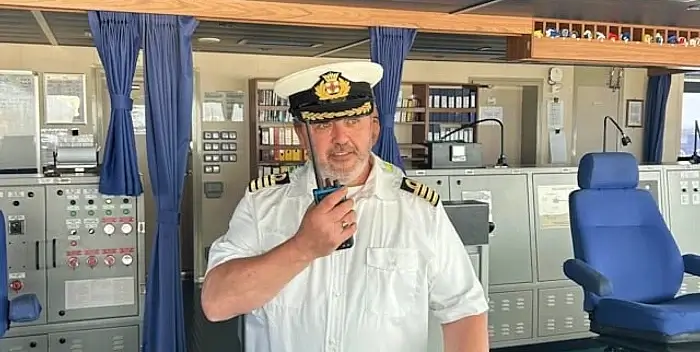 Captain Chris Phillips at the helm. Photo by the Department of Transport.