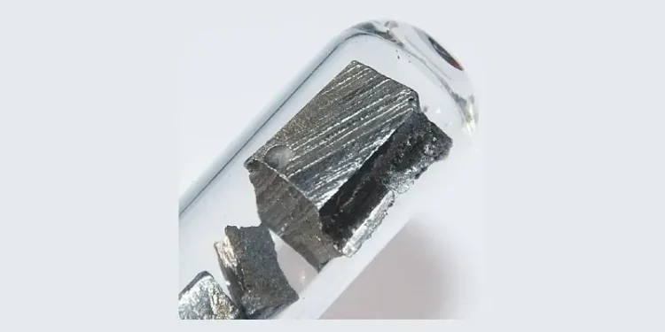 Ultrapure neodymium under argon, 5 grams. Photo by Hi-Res Images of Chemical Elements.