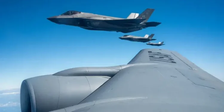 Three Air Force F-35A Lightning IIs, assigned to the 356th Expeditionary Fighter Squadron, fly in formation before aerial refueling over the Pacific Ocean, Dec. 11, 2025. Photo by air force Bermudez.