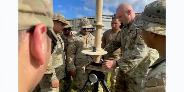 Army Chief Warrant Officer 3 Grant Borden at Fort Sill, Okla., instructs how to set up a fixed site-low, slow, small unmanned aircraft system integrated defeat system. Photo by Capt. Lajun