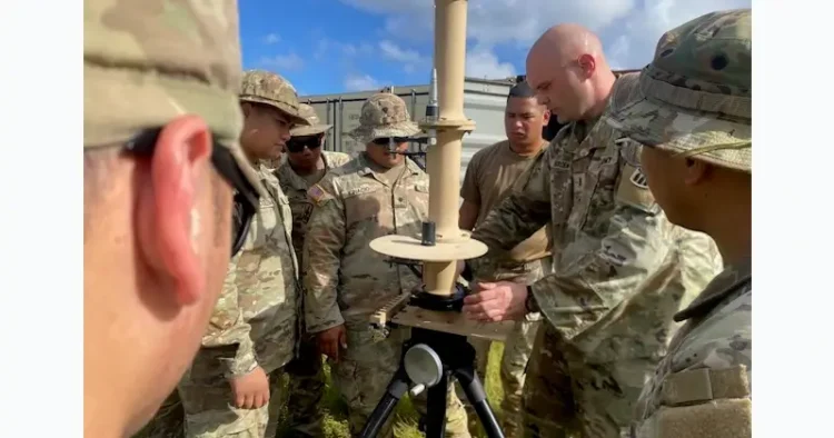 Army Chief Warrant Officer 3 Grant Borden at Fort Sill, Okla., instructs how to set up a fixed site-low, slow, small unmanned aircraft system integrated defeat system. Photo by Capt. Lajun
