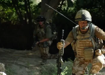British Major in Afghanistan using a mobile radio. Photo by Resolute Support Media.