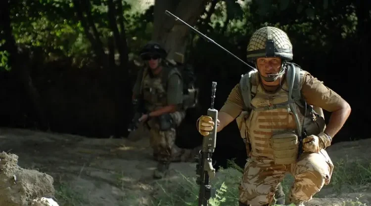 British Major in Afghanistan using a mobile radio. Photo by Resolute Support Media.