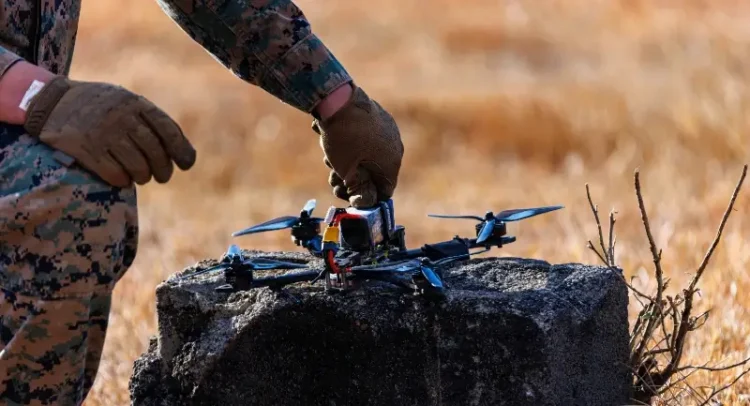 Marine sets up a counter-unmanned aerial system -a clay pigeon drone. Photo by Lance Corp. Melendez.