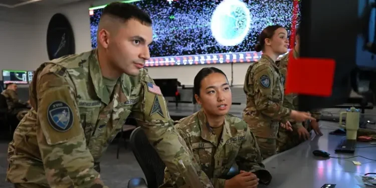 Space Force Spc. Roberto Santiago-Irizarry, and 2nd Lt. Yoon Jung Lee monitor Space Domain Awareness information at Vandenberg Space Force Base, Calif., Oct. 4, 2024. Photo by Cadet Dozoretz.