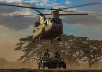 Soldiers assigned to the 2nd Battalion, 35th Infantry Regiment, 3rd Mobile Brigade, 25th Infantry Division, sling-load infantry squad vehicles to a CH-47 Chinook. Photo by Army Spec C. Moorehead.