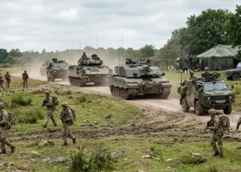 AI-generated photograph-style image of British Army personnel and armoured vehicles conducting a training exercise.