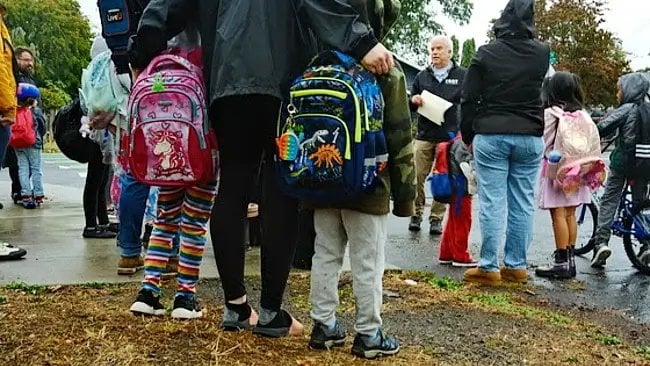 Students and families at Whitman Elementary School in the Brentwood-Darlington neighborhood prepare to walk to school together. Photo by PBOT.